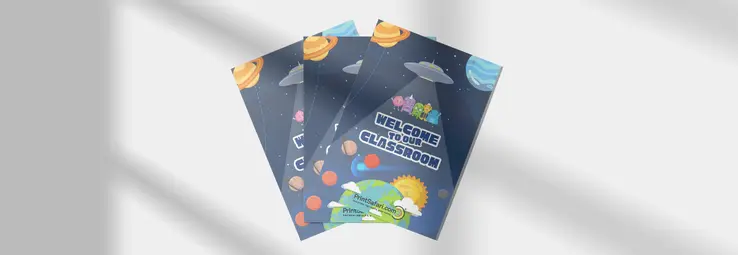 Posters stacked on top of each other on a white surface.