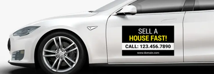 A car magnet advertising a real estate company.