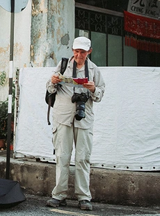 A tourist looking at a travel brochure
