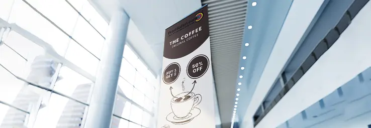 A banner inside a big exhibition hall.