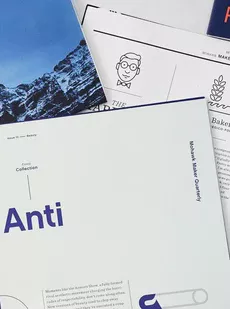 An image of brochures laying on top of each other.