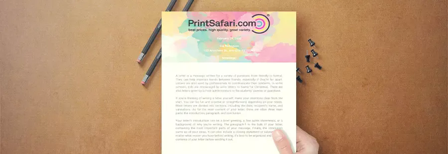 A colorful letterhead on top of a brown surface.