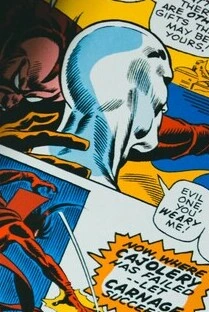 Close-up of a comic book scene featuring two superheroes, one hero shouting 'You weary me!' at the other, who appears to be the villain.