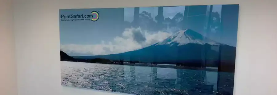 An acrylic photo print of a mountain and a lake.