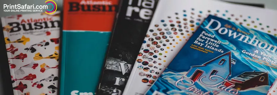 Multiple colorful brochures laying on each other.