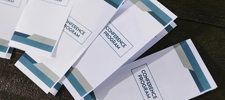 Folded brochures laying on a table.