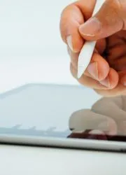 Hand drawing on digital tablet with stylus.