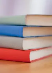 Stack of colorful hardcover journals displaying various cover color options