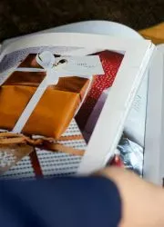 Browsing through a lookbook with vibrant product photography