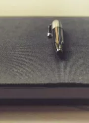 Professional notebook with black cover and pen