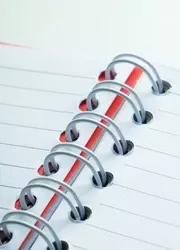 Close-up view of a Wire-O binding booklet with a white spiral.