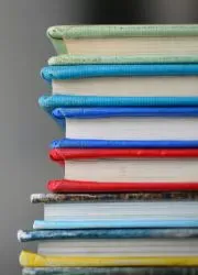 Stack of colorful yearbooks showing various design options