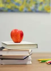 School yearbooks stacked on a desk