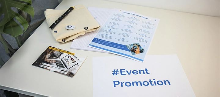 Event promotion business flyers laying on a white table.
