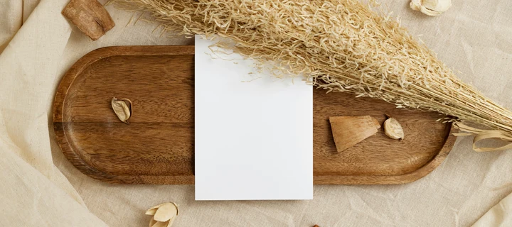 A white flyer on a wooden board.