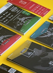 Staggered flyers on a yellow surface