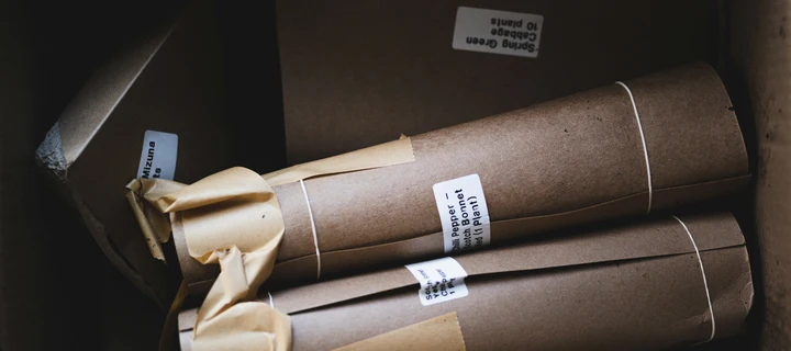 Custom labels sticking on cardboard rolls.