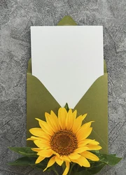 Business card inside of a green envelope
