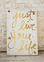 Custom Foam Board Poster in front of a stone wall
