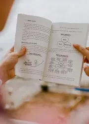 Handbook pages featuring diagrams and handwritten elements