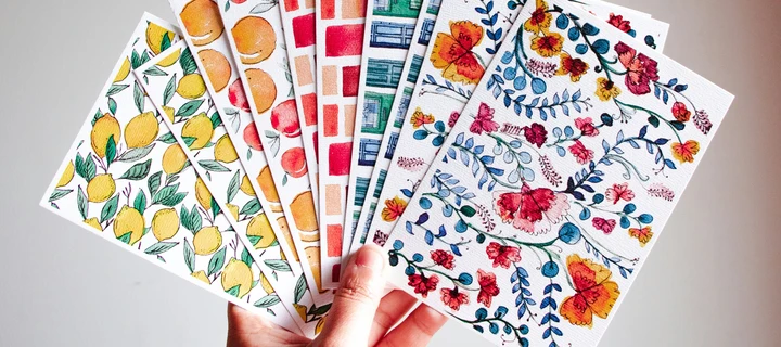 Hand holding multiple colourful Flyers