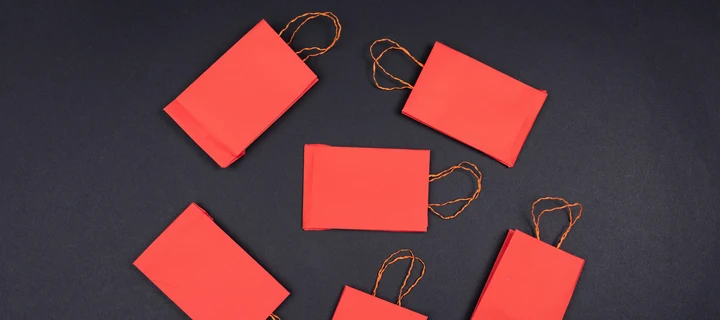 Multiple Paper Bags laying on a table photographed from a top-view