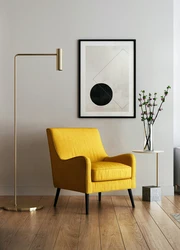Framed Print hanging on a wall on top of an armchair