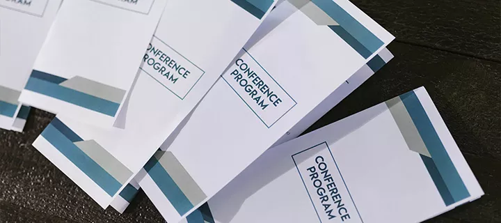 Folded brochures laying on a table.