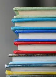 Stack of colorful yearbooks showing various design options