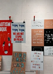 Flyers hanging in front of a wall