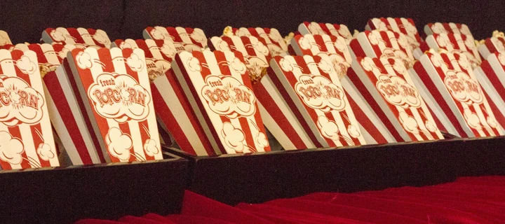 Multiple popcorn boxes lined up in a row