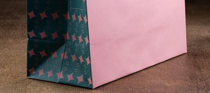 Multiple Paper Bags laying on a table photographed from a top-view