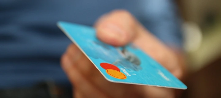 A close up photograph of a blue plastic card.