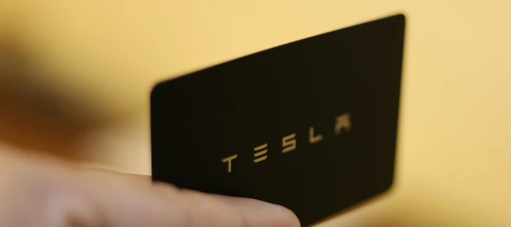 A close up photograph of a black plastic key card.