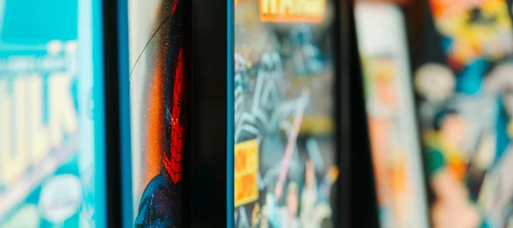 Several comic books lined up next to each other.