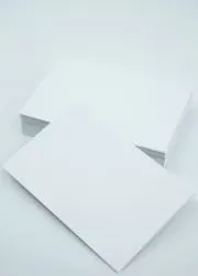 Minimalist white business cards with geometric accents