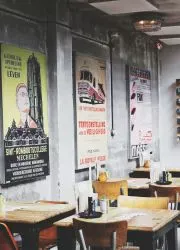 Vintage event posters decorating a restaurant