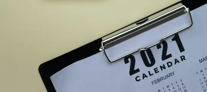 A year planner secured in a clipboard.