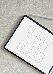 A tablet displaying a year planner on its screen.