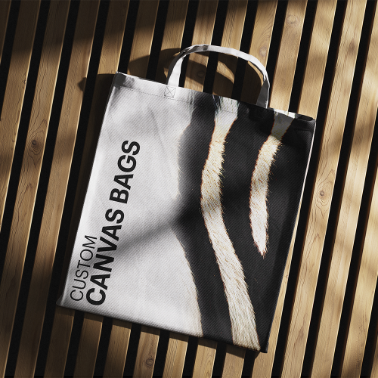 Custom paper shopping bag with black handles, featuring a bold zebra stripe design and the text 