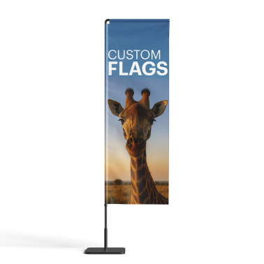 Custom feather flag with a giraffe against a sunrise background and the text custom flags, displayed on a flat black base.