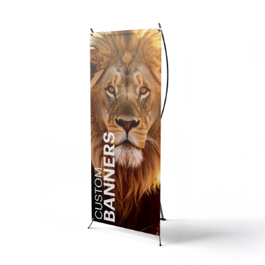 Vertical custom X-banner stand displaying a powerful lion portrait with the text 