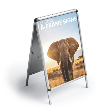 Custom A-frame sign featuring a photo of an elephant at sunrise with the headline 